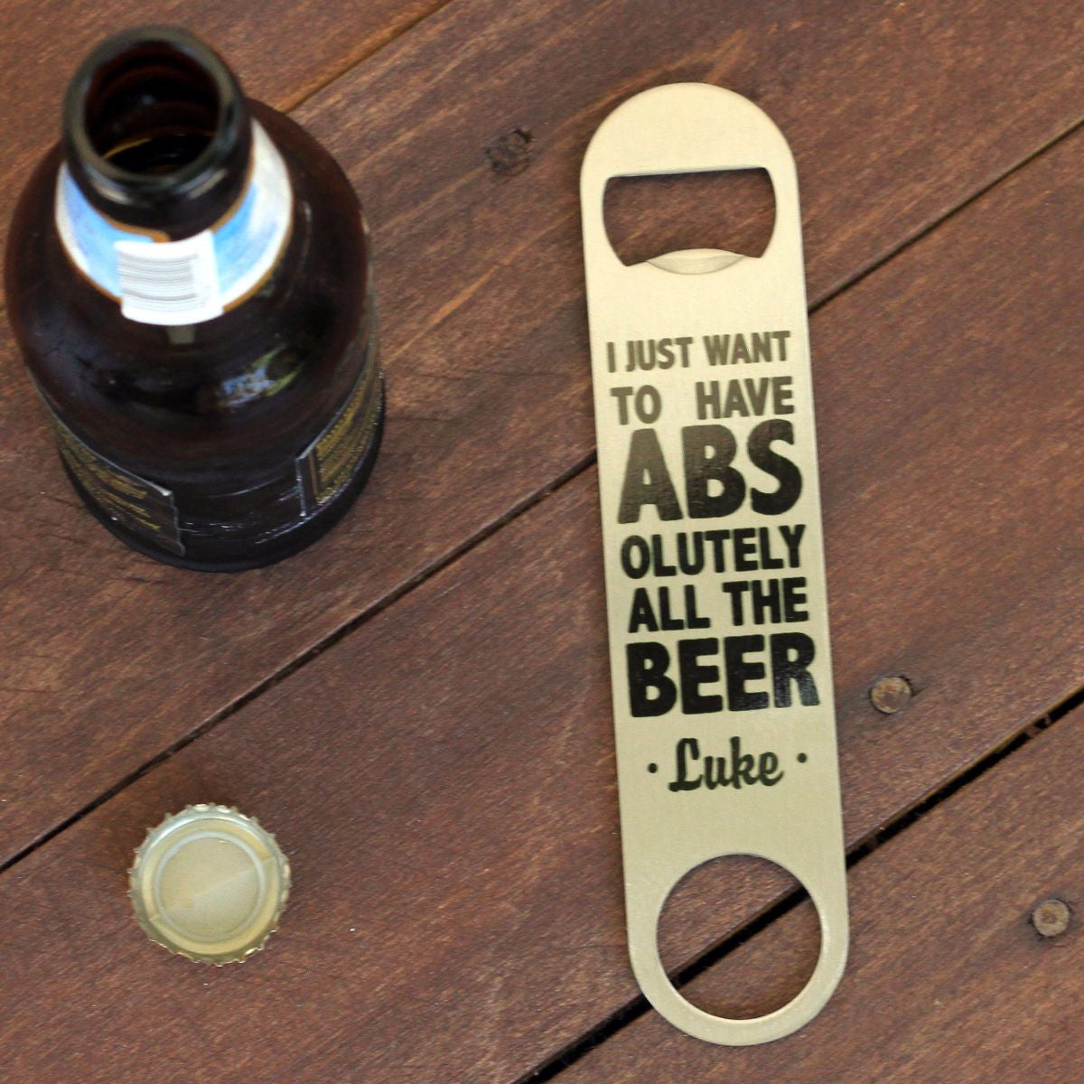 A closeup shot of bottle openers with funny beer quotes Stock